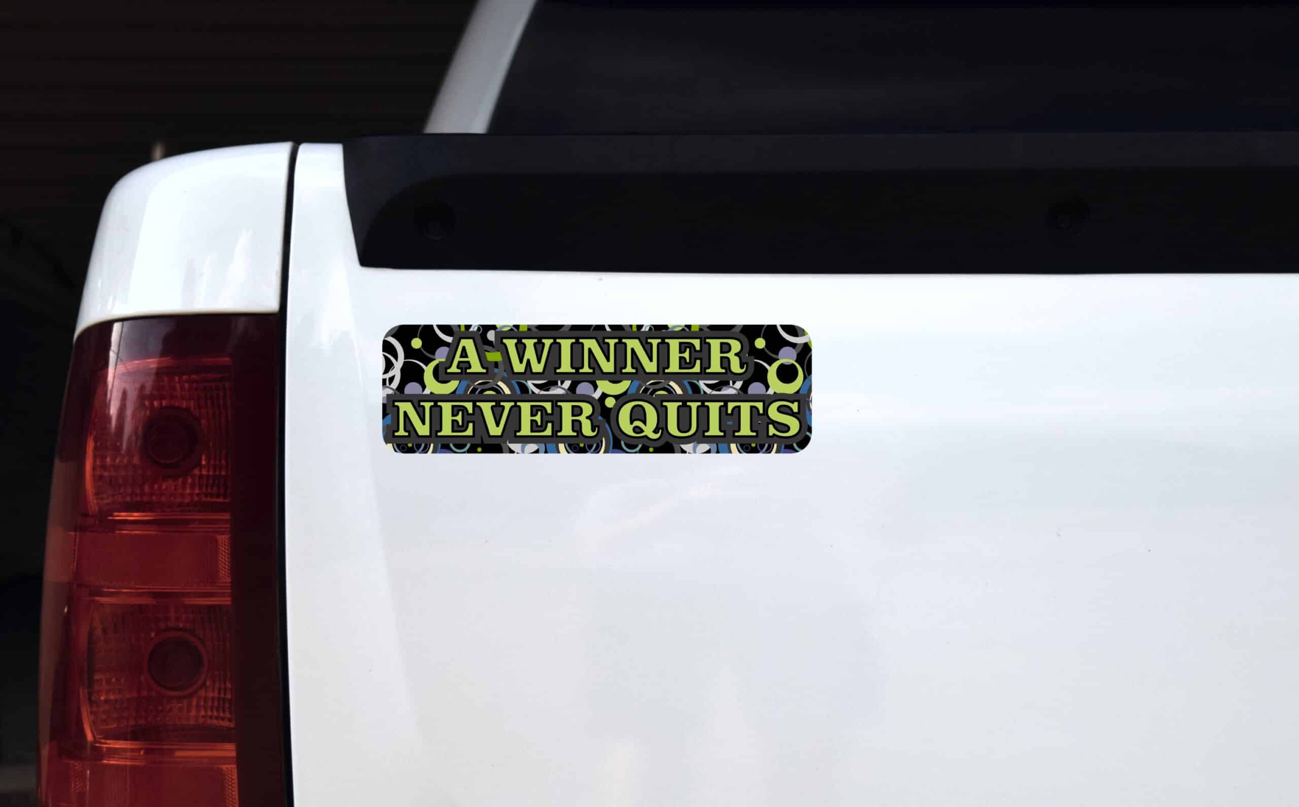 10in x 3in Winner Never Quits Vinyl Bumper Sticker Car Decal Win