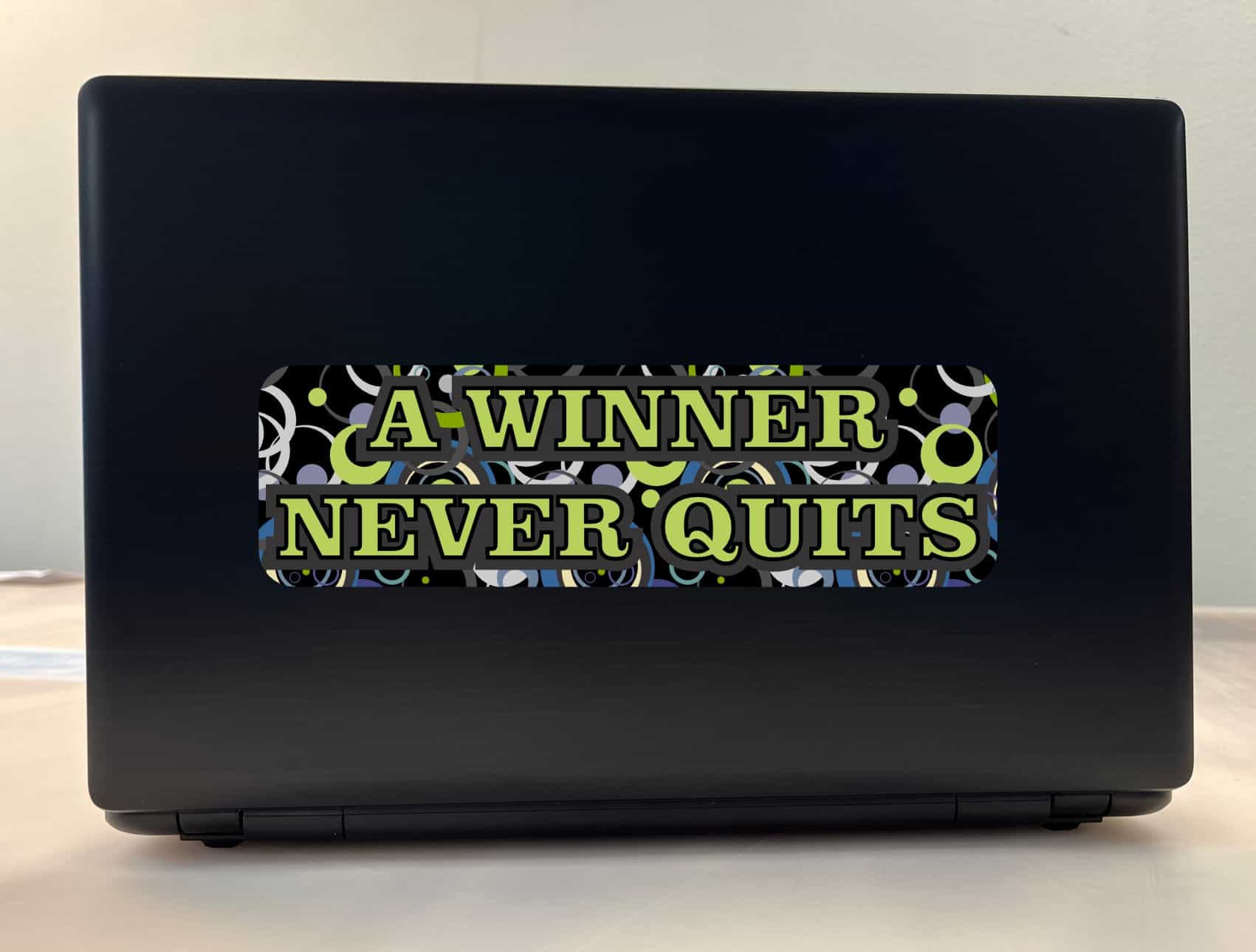 10in x 3in Winner Never Quits Vinyl Bumper Sticker Car Decal Win