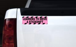 Alternative view of 10in x 3in Pink Learning to Drive a Stickshift Magnet