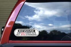 10in x 3in Dog Looks Cute Bites Strangers Vinyl Sticker