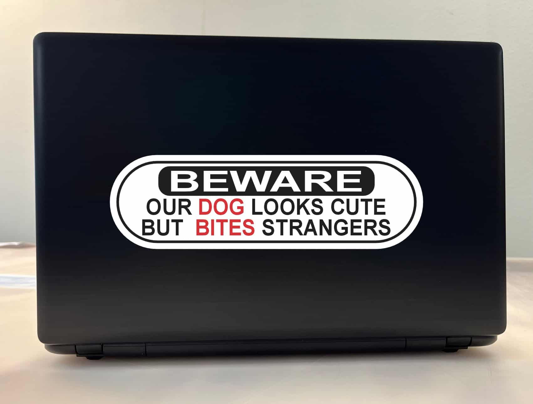 10in x 3in Dog Looks Cute Bites Strangers Vinyl Sticker
