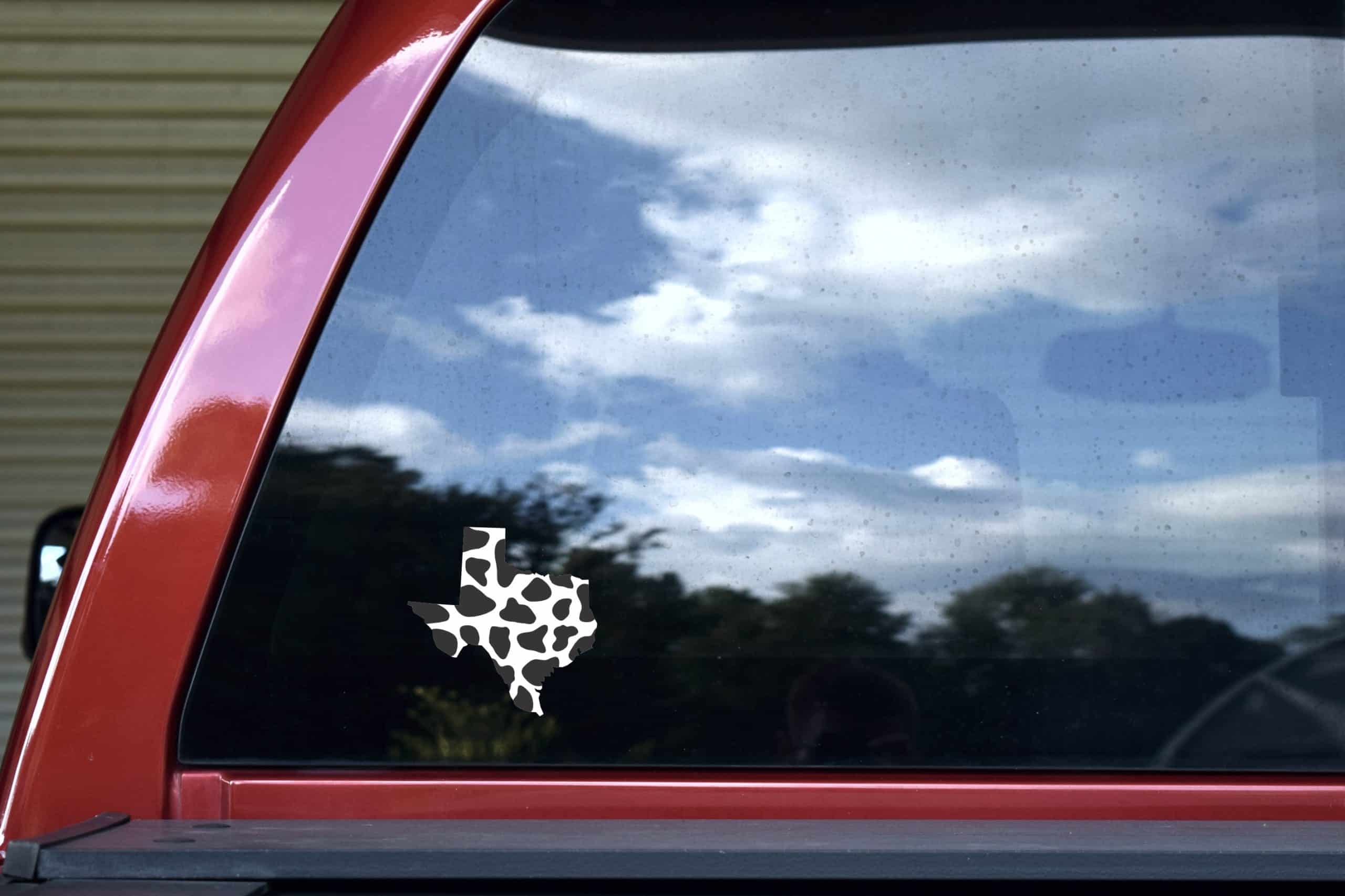 Texas state outline, Holstein cow print pattern, black spots on white background - vinyl removable sticker