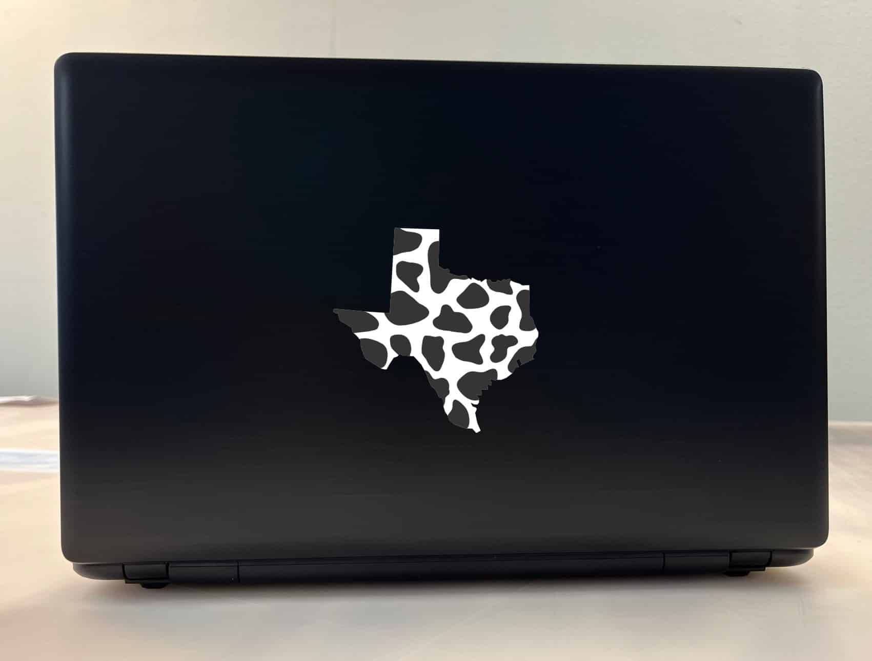 Texas state outline, Holstein cow print pattern, black spots on white background - vinyl removable sticker