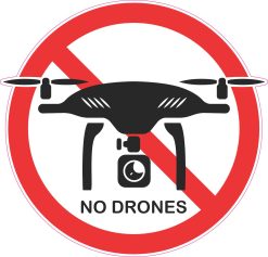 red prohibition circle, diagonal restriction line, black drone silhouette - vinyl removable sticker