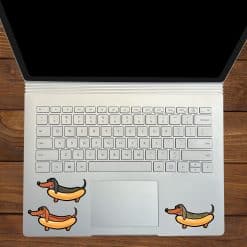 cartoon dachshunds, hot dog buns, condiment squiggles - vinyl removable sticker