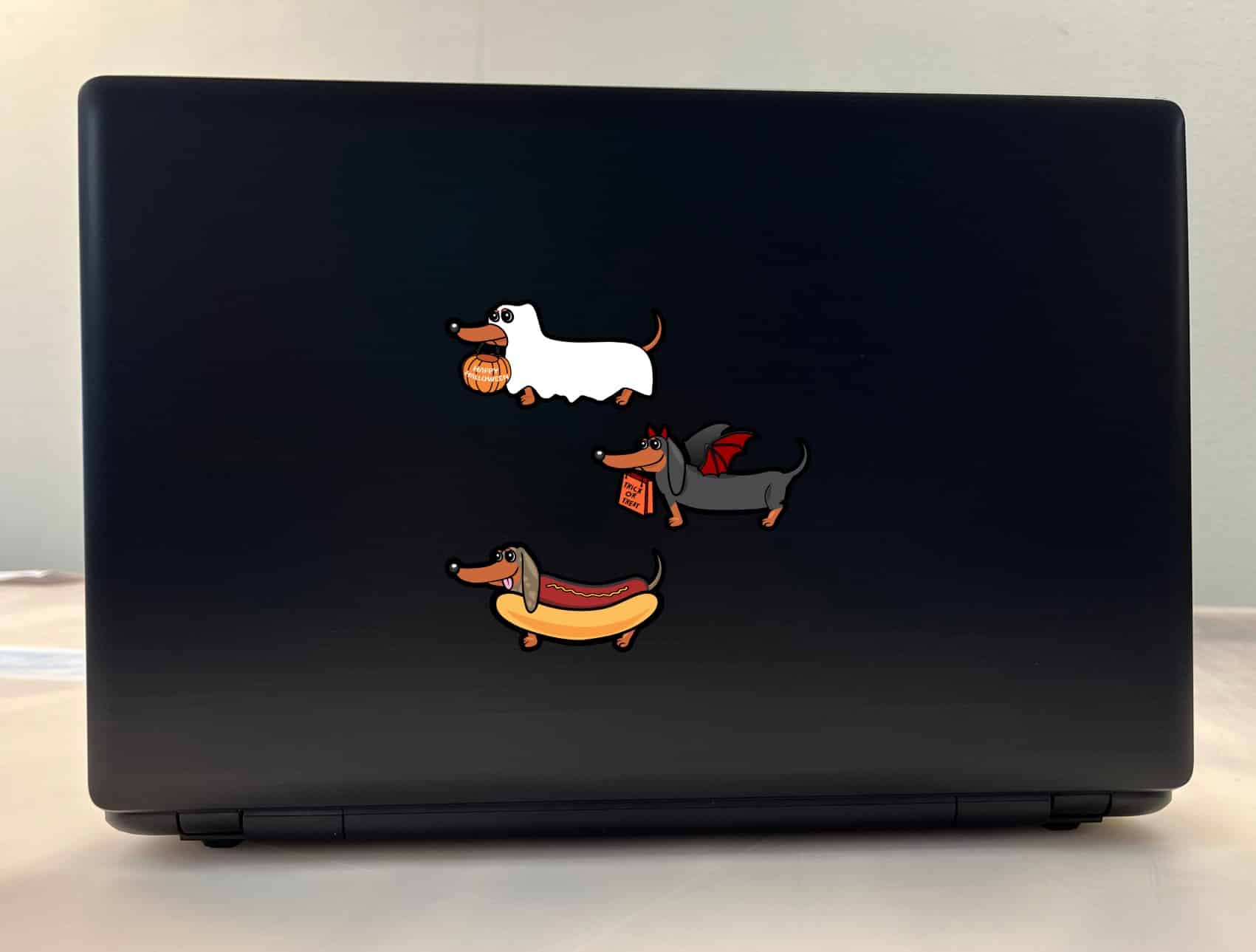 cartoon dachshunds, Halloween costumes, pumpkin basket - vinyl removable sticker