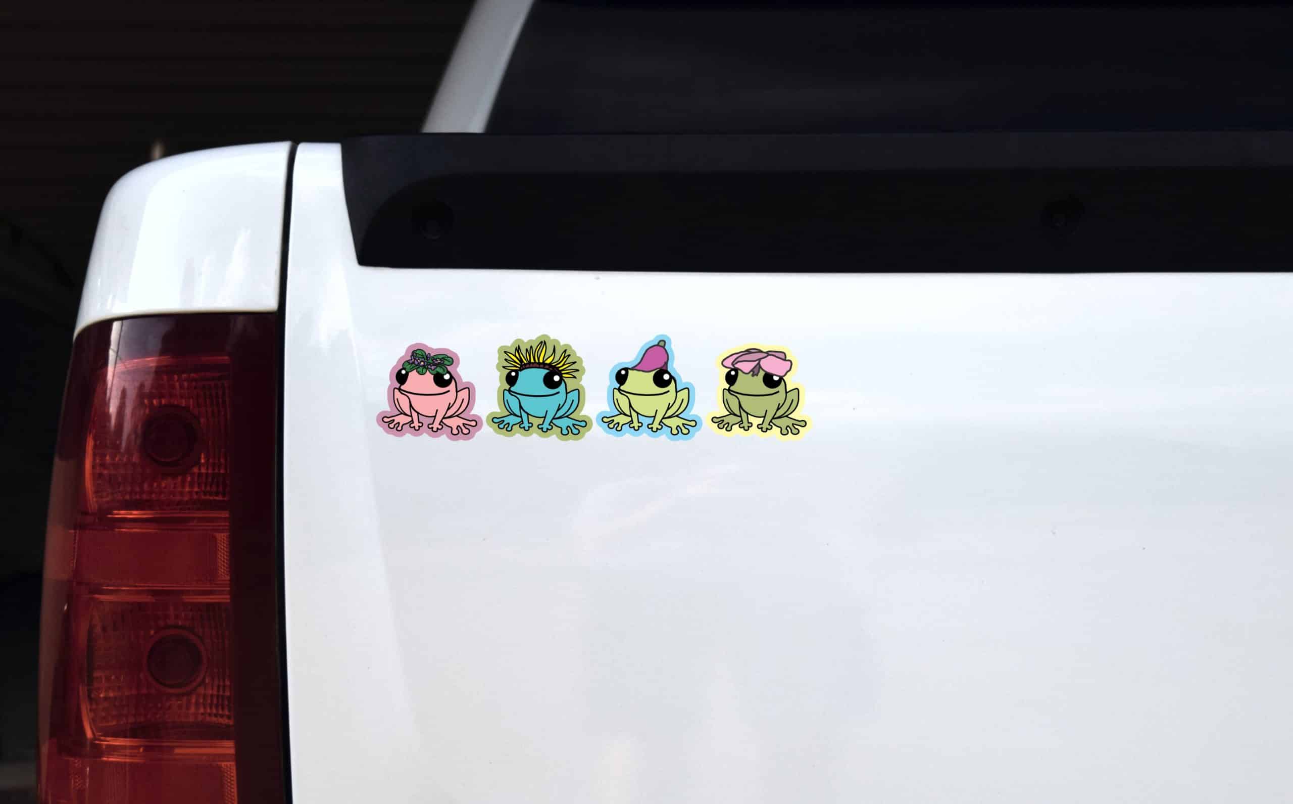 cartoon frogs, floral accessories, smiling expressions - vinyl removable sticker