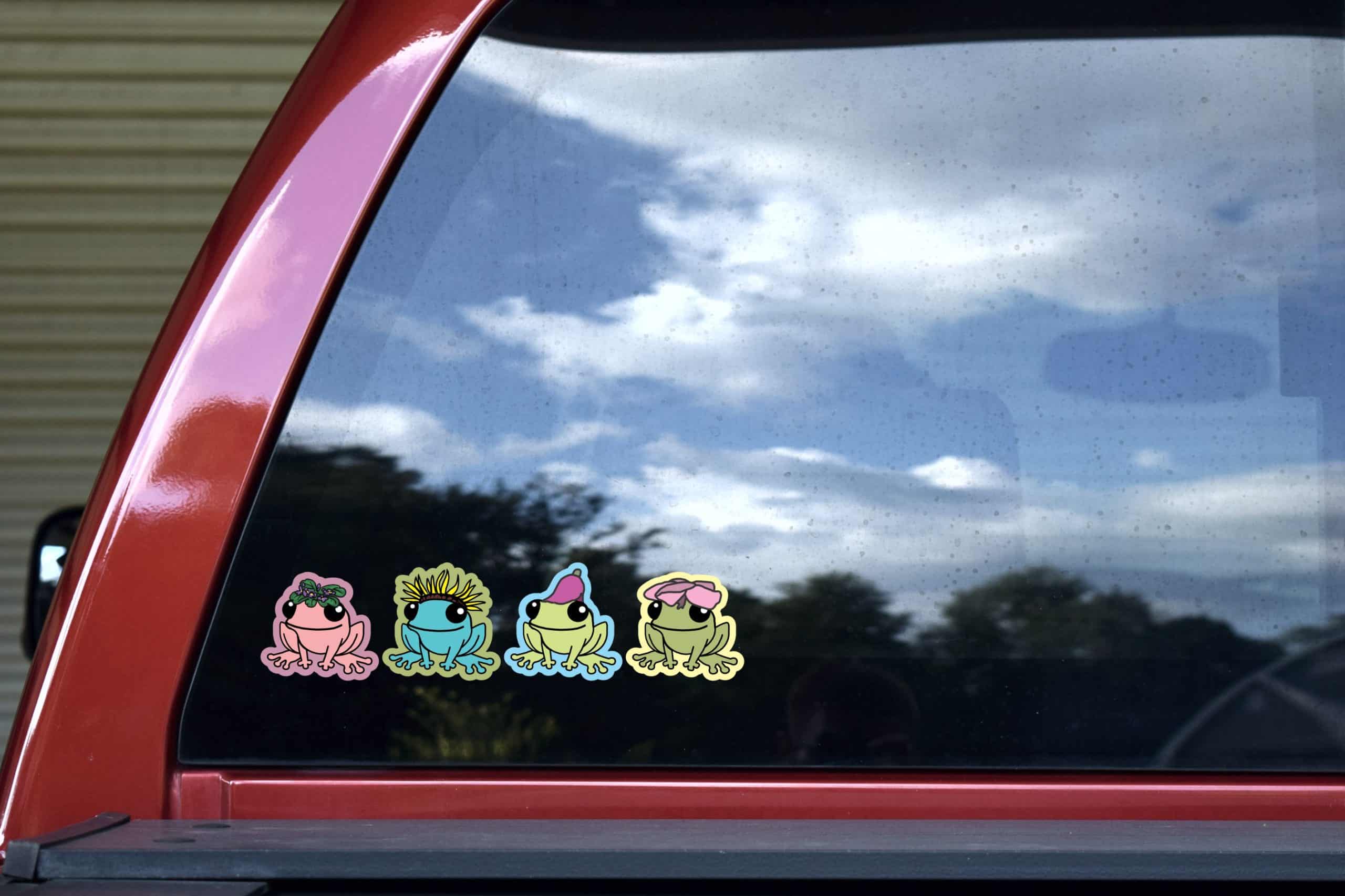 cartoon frogs, floral accessories, smiling expressions - vinyl removable sticker