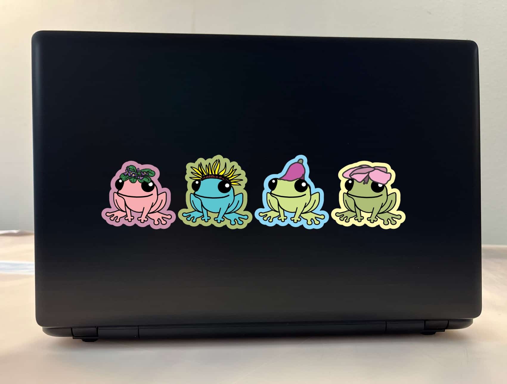 cartoon frogs, floral accessories, smiling expressions - vinyl removable sticker