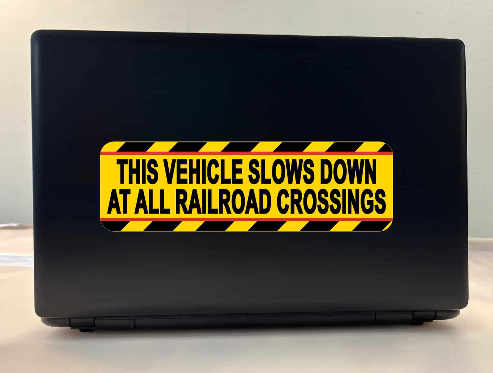 bold black text, bright yellow background, diagonal striped borders - vinyl removable sticker