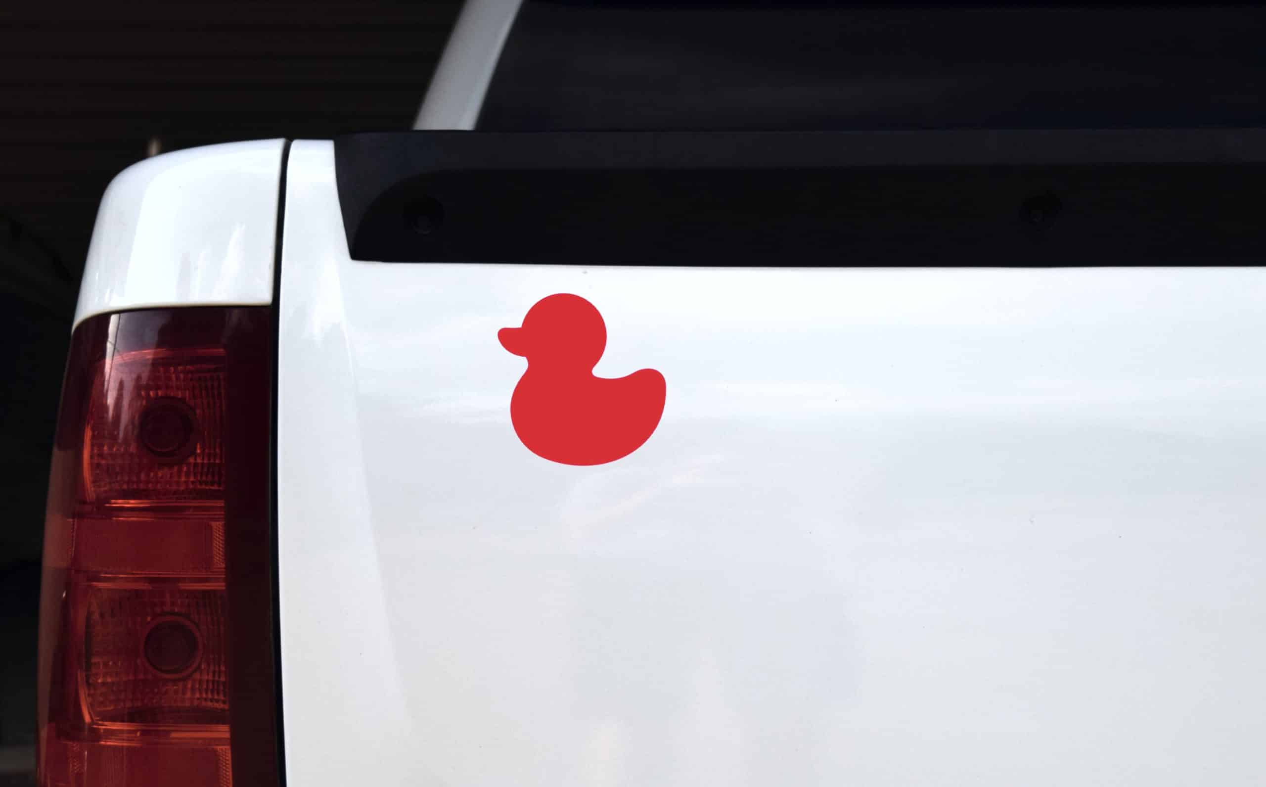 rubber duck silhouette, solid red color, classic toy shape - vinyl removable sticker