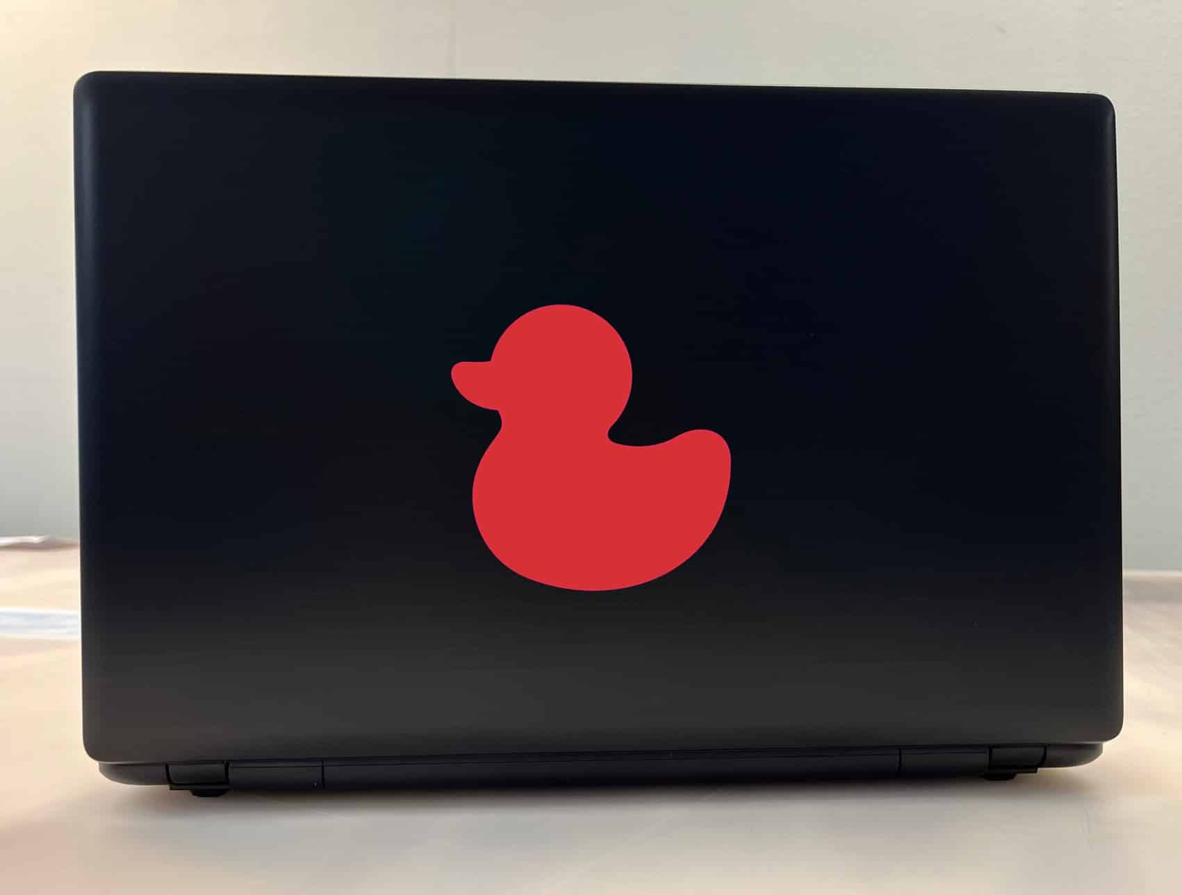 rubber duck silhouette, solid red color, classic toy shape - vinyl removable sticker