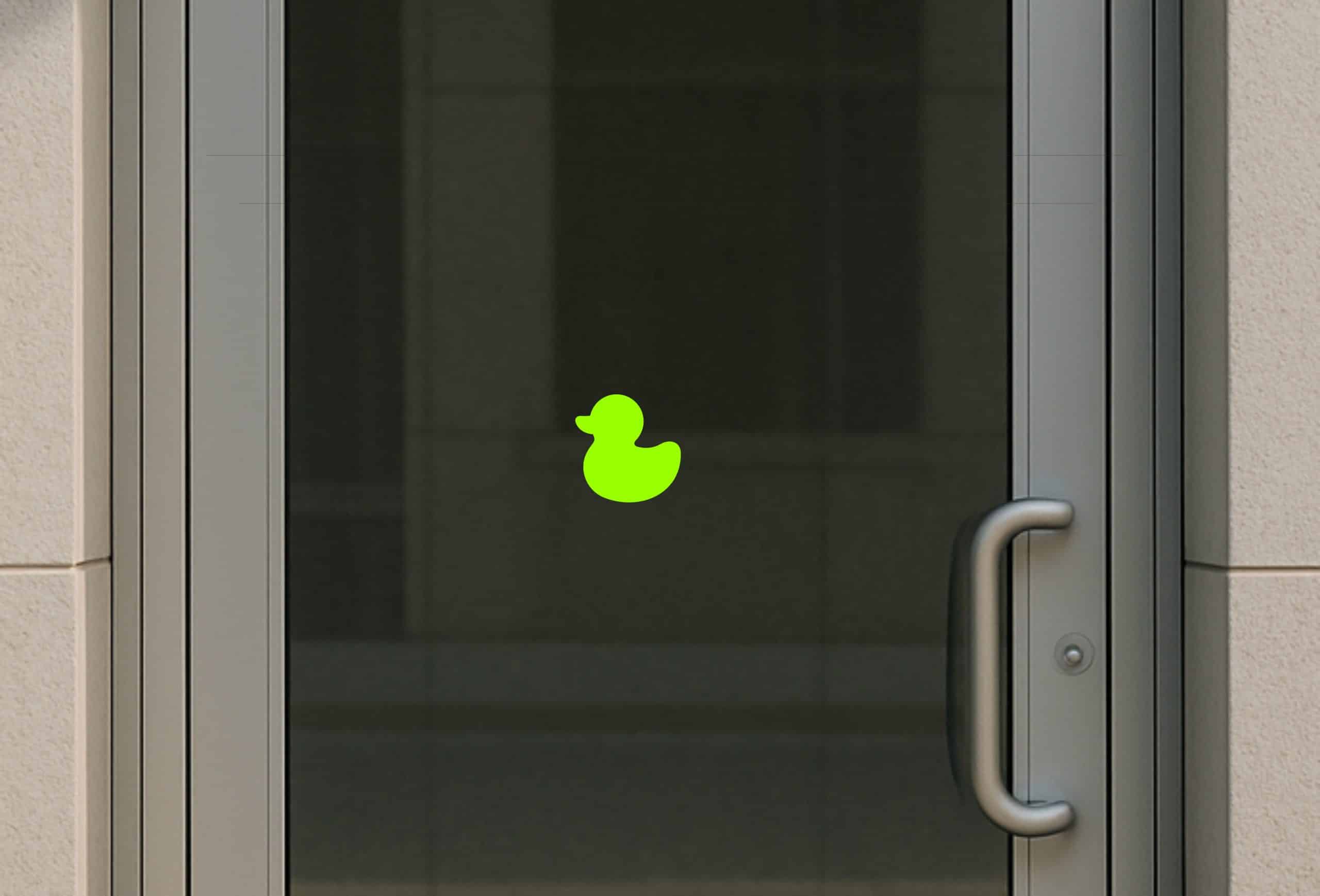 rubber duck silhouette, curved duck body, rounded head with bill - vinyl removable sticker