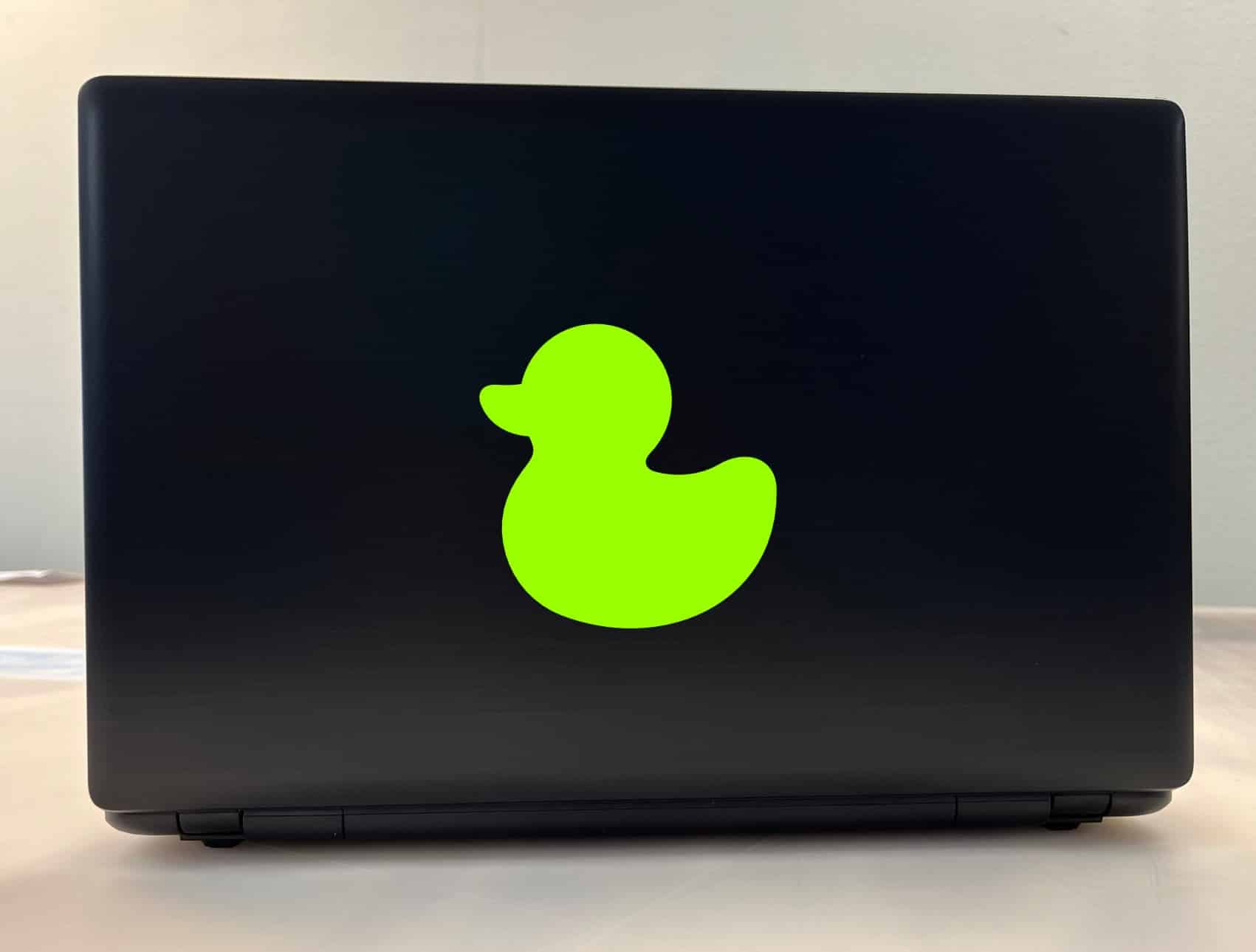 rubber duck silhouette, curved duck body, rounded head with bill - vinyl removable sticker