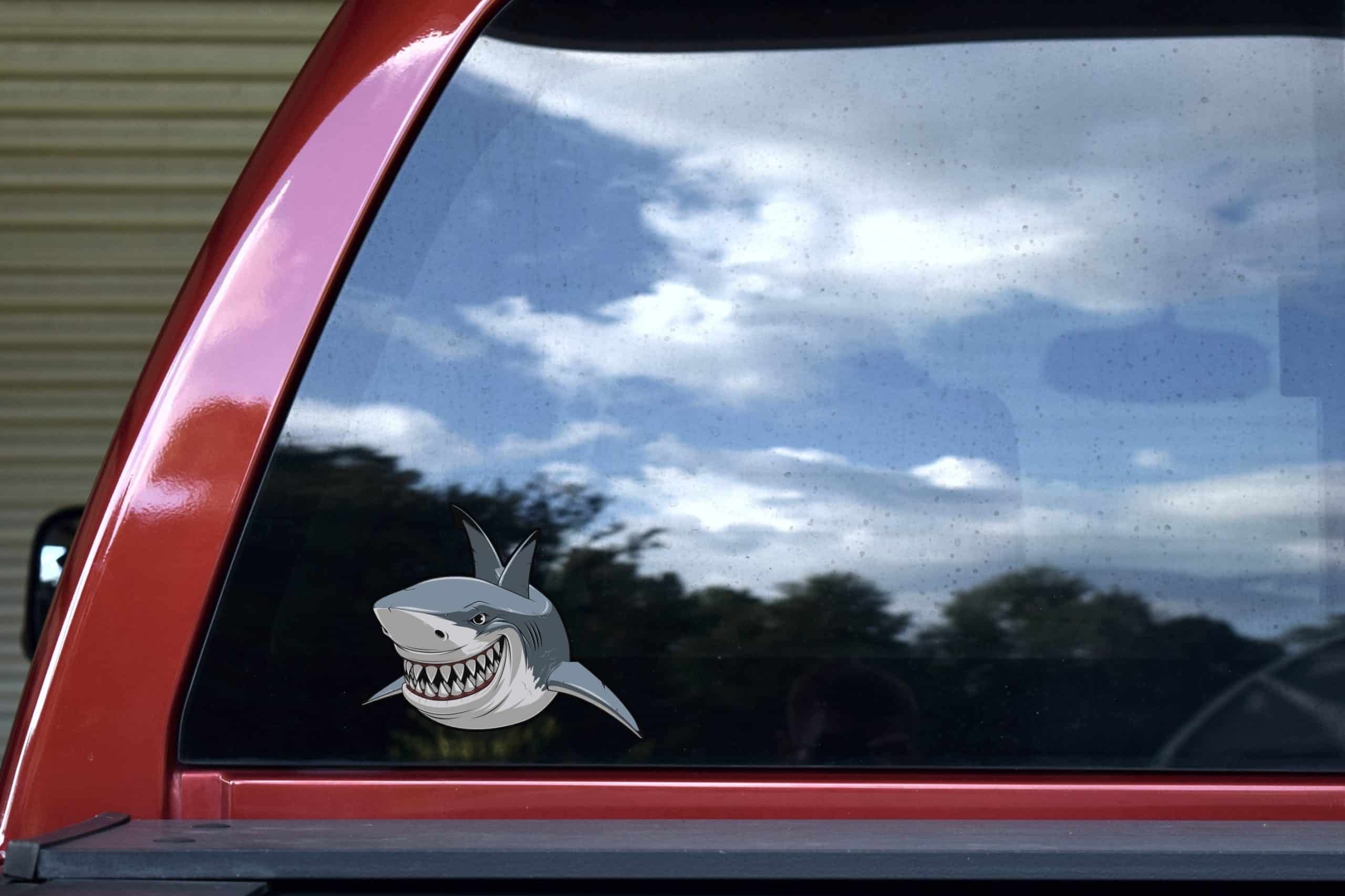 menacing shark face, sharp teeth, cartoon-style artwork - vinyl removable sticker