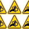 triangular warning shape, hand and gear silhouette, bold contrasting colors - vinyl removable sticker